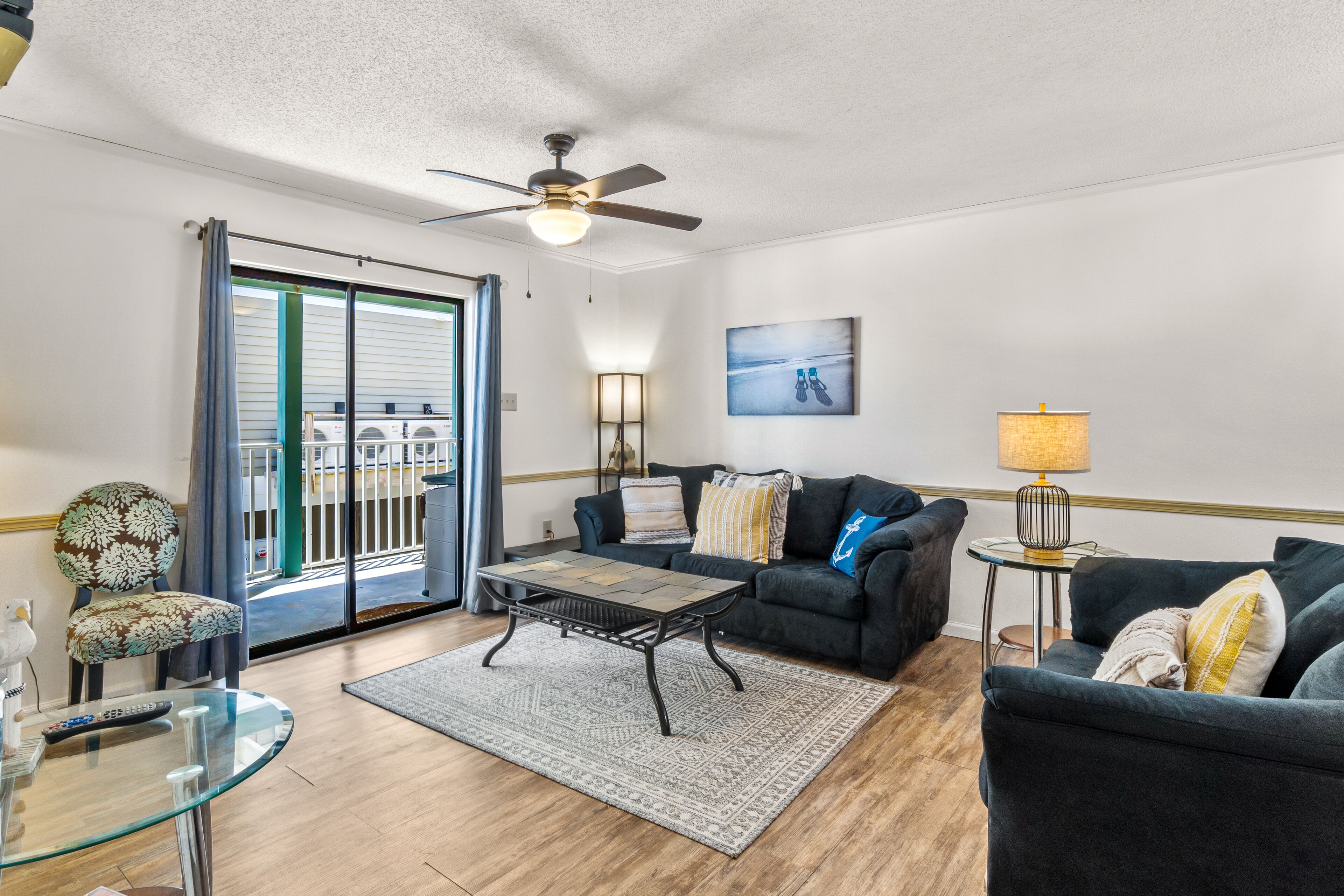 Gulf-side getaway w/ beach access, a shared outdoor pool, and furnished balcony