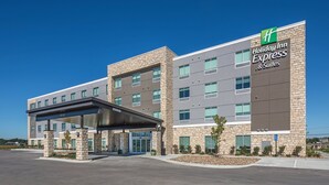 A Holiday Inn Express & Suites building with a modern design, featuring a covered entrance and a clear sky. - Holiday Inn Express & Suites West Omaha - Elkhorn by IHG (Elkhorn)