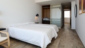 A hotel room with two beds, a desk, a wardrobe, and a walk-in closet. - Luxe Loft Casa Atlantica Morro Jable 658 BY PVL (Morro Jable)