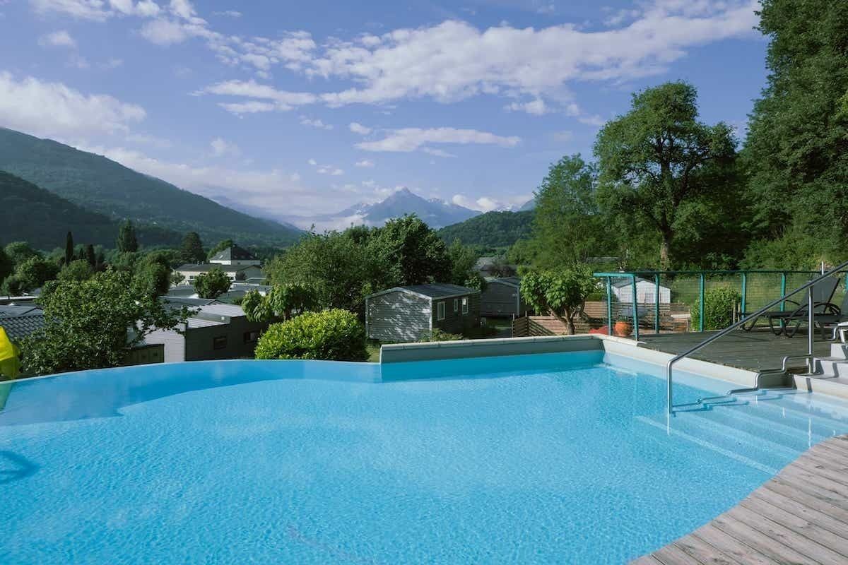 Seasonal outdoor pool, open 10:00 AM to 8:00 PM, pool umbrellas