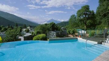 Seasonal outdoor pool, open 10:00 AM to 8:00 PM, pool umbrellas