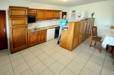 Fridge, electric kettle, cookware/dishes/utensils