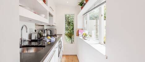 One-Bedroom Apartment | Private kitchen | Full-sized fridge, microwave, oven, stovetop