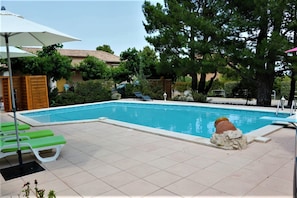 Seasonal outdoor pool, pool loungers