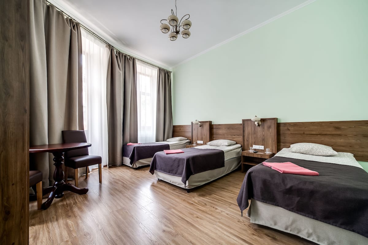 Standard Triple Room (Private bathroom, not in room) | 1 bedroom, free WiFi, bed sheets