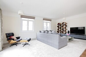 Three-Bedroom Apartment | Living room | TV, DVD player
