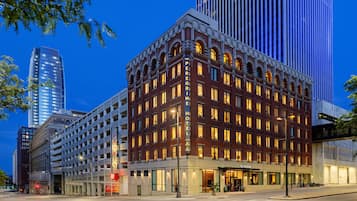 A historic hotel with a classic facade, multiple stories, and a prominent entrance.