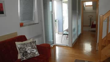 Appartement Deluxe | Coin séjour | Télévision à écran plat
