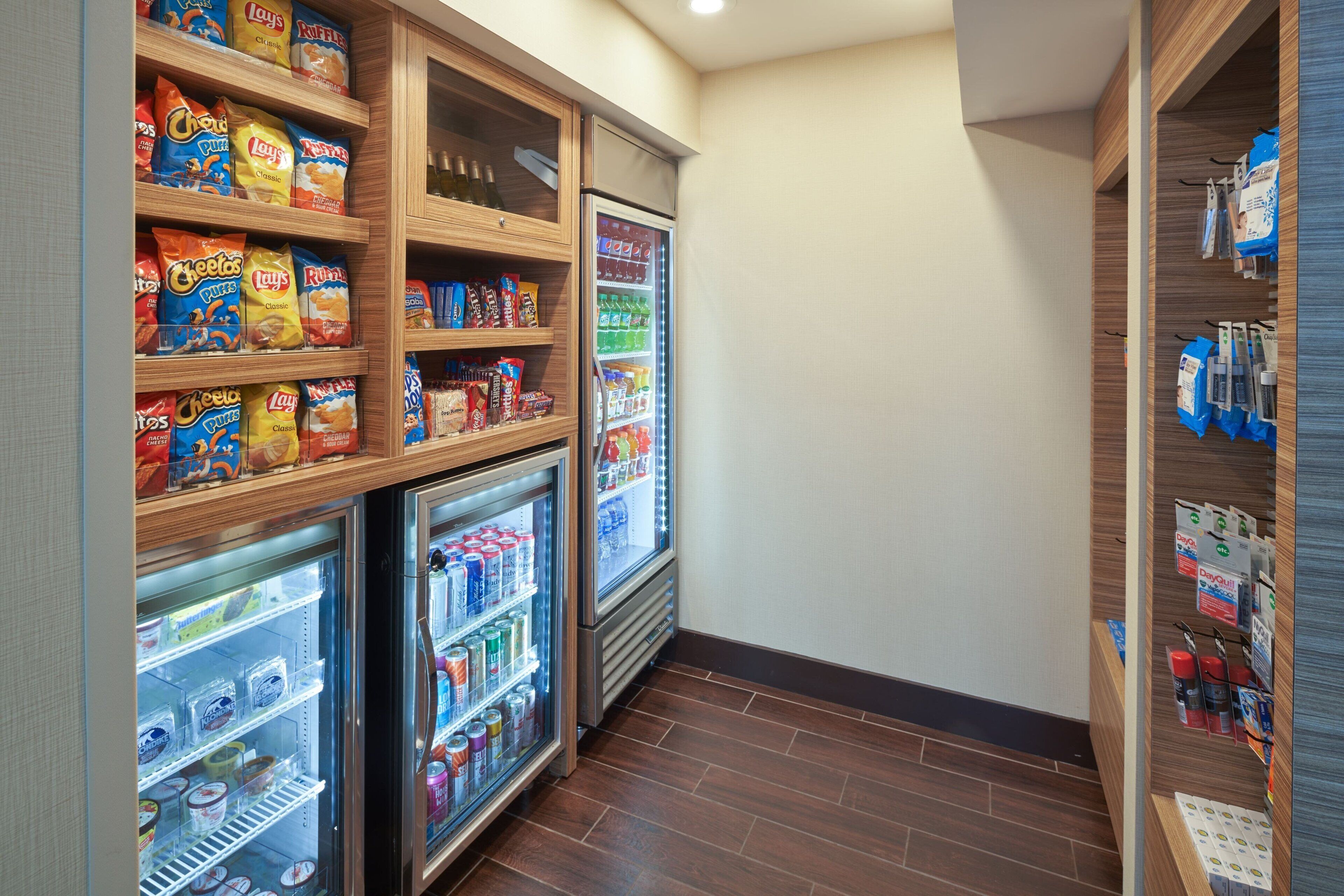 A snack and beverage vending area with various snacks and drinks.