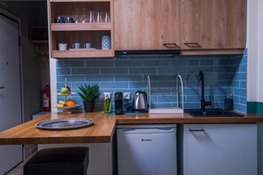 Mini-fridge, stovetop, coffee/tea maker, electric kettle