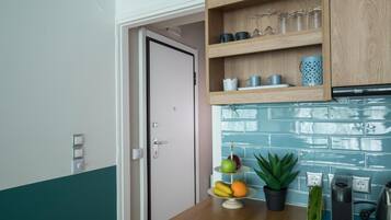 Mini-fridge, stovetop, coffee/tea maker, electric kettle