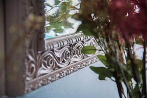 A close-up of an ornate mirror with intricate designs. - Rastoni Athens Suites nearAcropolis at Tsatsou Street (Athens)
