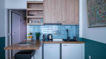 Mini-fridge, stovetop, coffee/tea maker, electric kettle