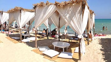 Private beach, white sand, sun loungers, beach umbrellas