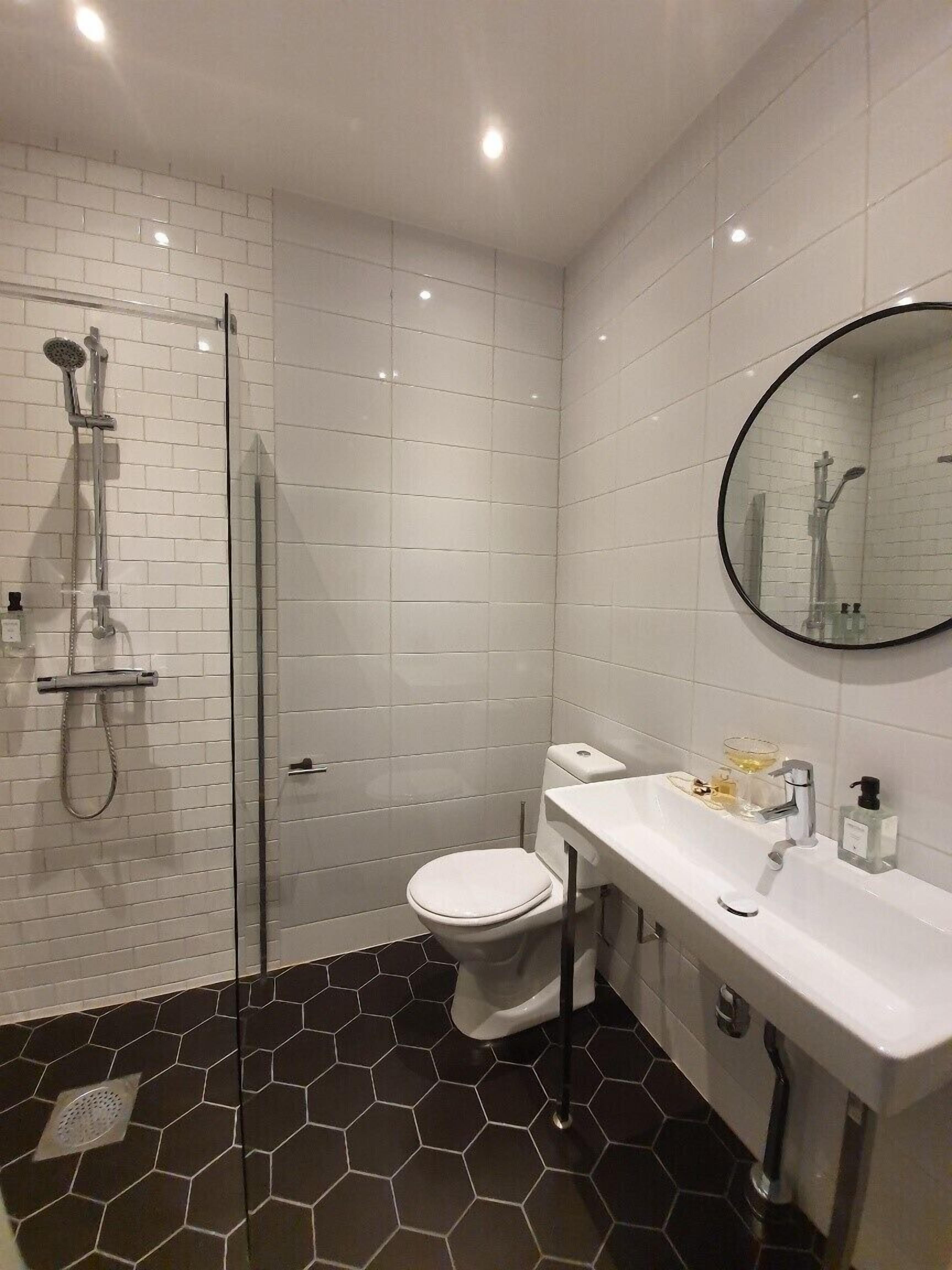 single room | bathroom | shower, hair dryer, towels, soap