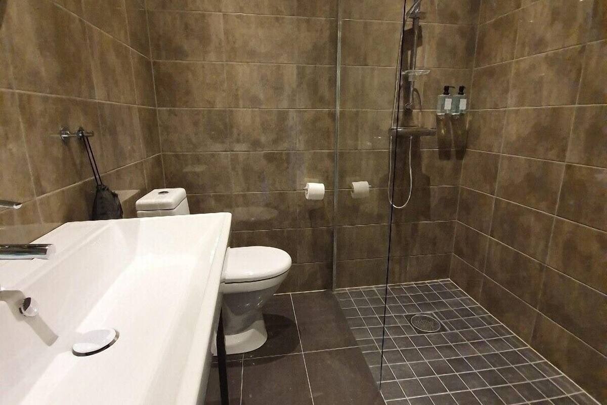 superior double room | bathroom | shower, hair dryer, towels, soap