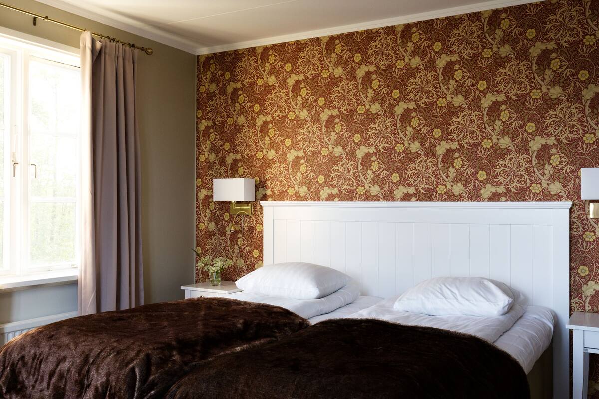 Blackout curtains, iron/ironing board (on request), cots/infant beds