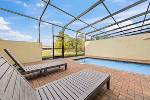 Sun-kissed pool deck perfect for relaxing. - Theme Rooms! 5BR Townhouse w Pool in Kissimmee (Kissimmee)