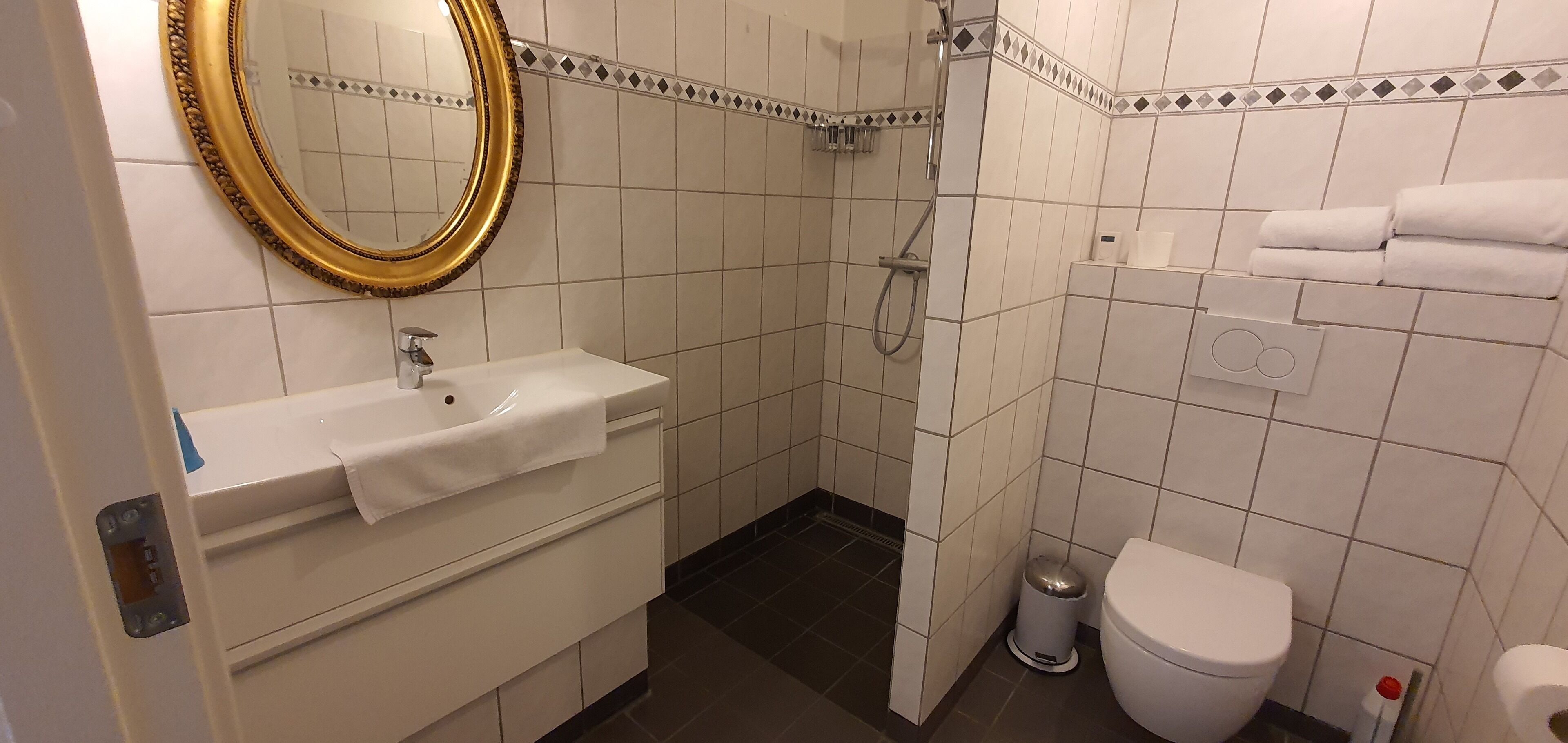 standard double room | bathroom | shower, rainfall showerhead, heated floors, towels