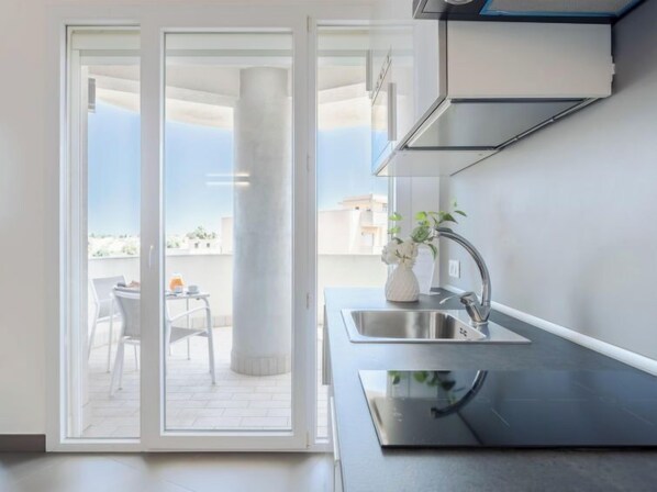 Fridge, microwave, cookware/dishes/utensils