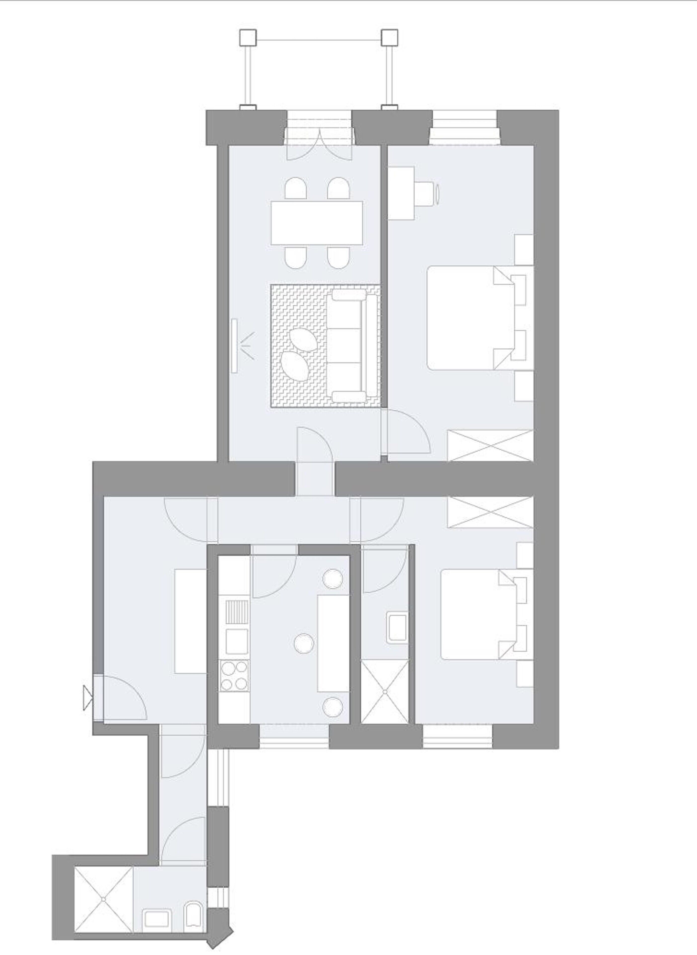 A floor plan of a hotel with multiple rooms, a central lobby, and a dining area.
