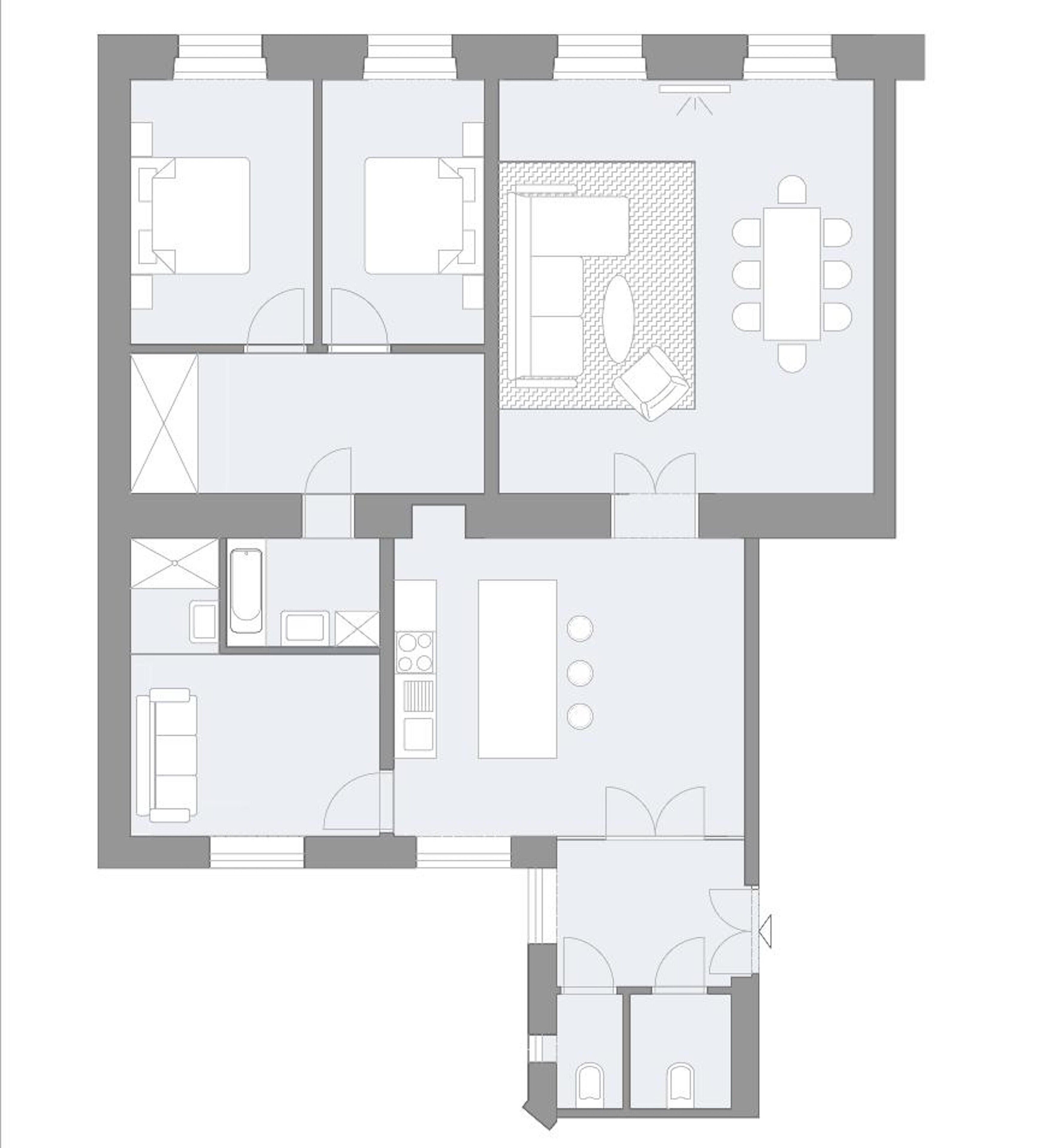 A floor plan of a hotel with a bedroom, bathroom, kitchen, dining area, and a small living room.