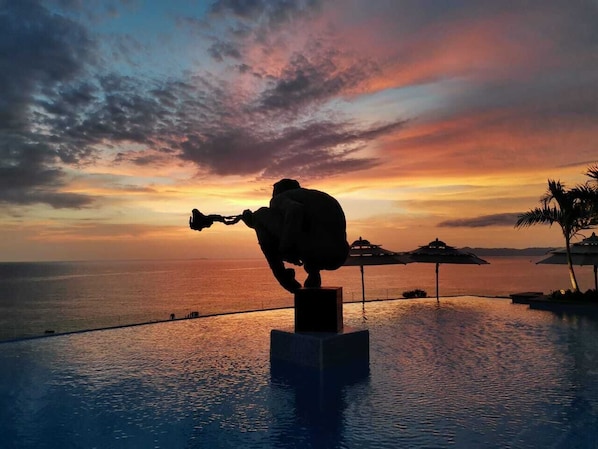 Outdoor pool, open 9:00 AM to 9:00 PM, pool umbrellas, sun loungers