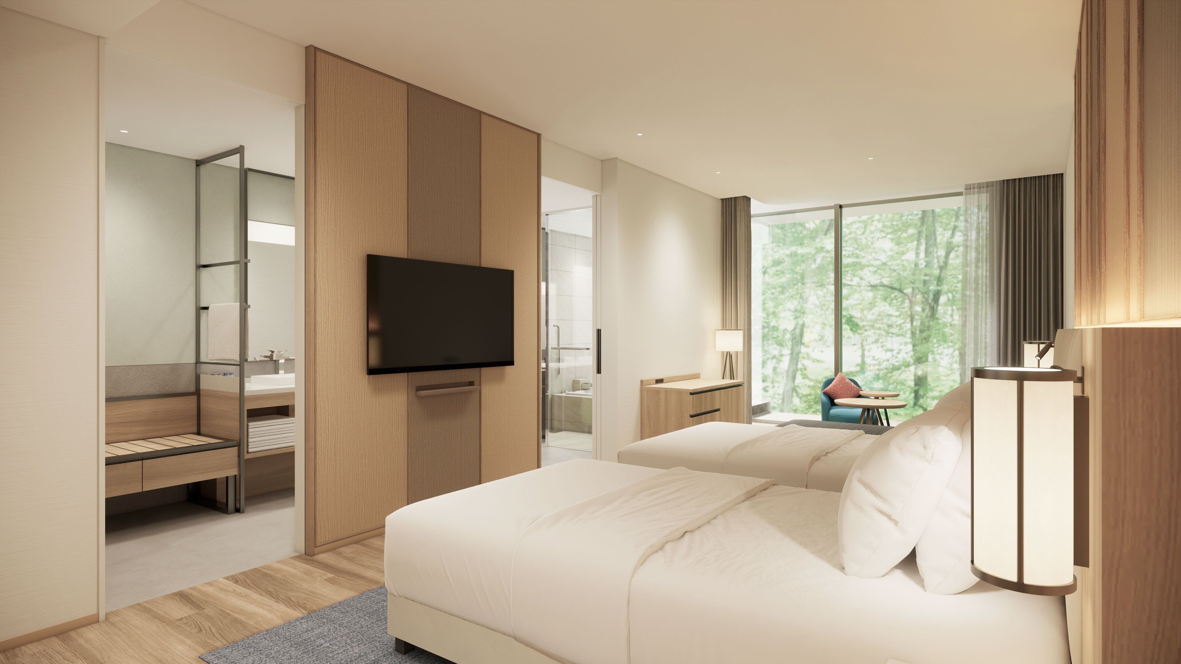 A modern hotel room with a large bed, a flat-screen TV, a desk with a chair, and a view of trees through the window.