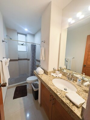 Shower, hair dryer, towels, soap