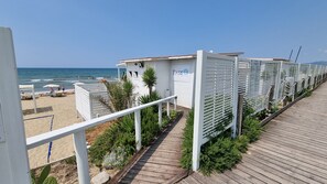 On the beach, sun loungers