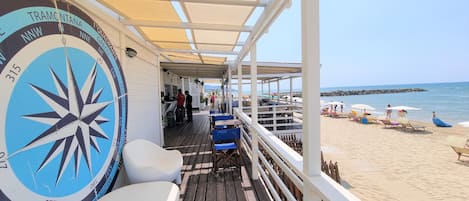 On the beach, sun loungers