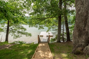Step down to the dock and enjoy serene lake views surrounded by lush greenery.