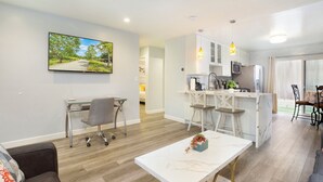 A modern apartment with a living room, kitchen, and dining area. - No Stairs! Walk 2 Ocean, FastWiFi, PoolTable, Magnolia Perch! STR14-0085 (Dana Point)