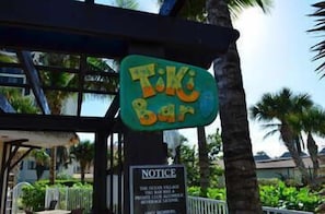 A Tiki Bar sign with a notice sign below it. - OV 318 Pond/Golf Course View Condo (Fort Pierce)