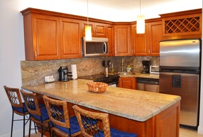 Fridge, microwave, oven, stovetop - OV 617 Pond/Golf Course View Condo-Paradise Vacation Rental in Ocean Village (Fort Pierce)