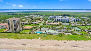 A resort with multiple buildings, a beach, and a large pool area. - CP 315 Dune View Condo -Paradise Vacation Rental in Ocean Village (Fort Pierce)