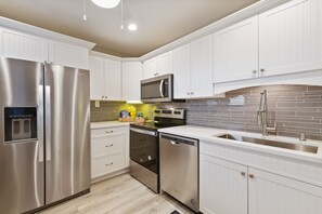 Fridge, microwave, oven, stovetop - CP 133 Ocean View Condo - Vacation Rental in Ocean Village (Fort Pierce)