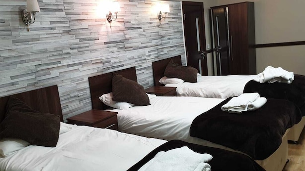 Deluxe Triple Room, Private Bathroom | In-room dining