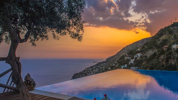 A poolside area with a view of the sea and a sunset. - VILLA COSTIERA - Five Bedroom Villa, Sleeps 10 (Amalfi)