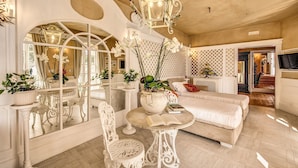A spacious room with a large mirror, white furniture, and decorative plants. - VILLA COSTIERA - Five Bedroom Villa, Sleeps 10 (Amalfi)