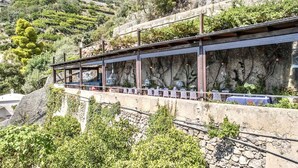 A long, narrow building with a stone facade and a series of windows. - SELENE - Eight Bedroom Villa, Sleeps 16 (Ravello)