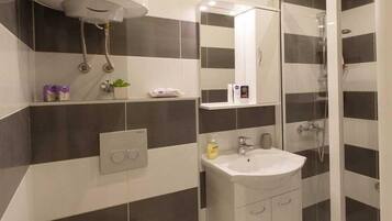 Shower, free toiletries, hair dryer, slippers