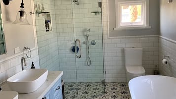 Bathtub, hair dryer, towels, soap