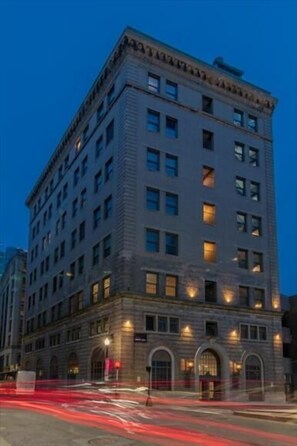 Classic building with a symmetrical facade and evenly spaced windows.