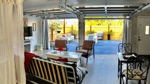 A covered patio area with a dining table, chairs, and a sofa. - Romantic retreat walking distance to wineries  (Temecula)
