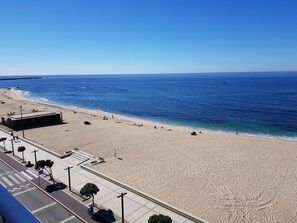 On the beach, sun-loungers
