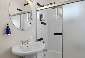 Combined shower/tub, hair dryer, towels, soap
