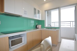 Panoramic Apartment, 3 Bedrooms | Private kitchen | Fridge, microwave, stovetop, cookware/dishes/utensils - The Crystal Apartment (Nha Trang)