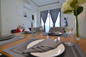 Signature Apartment, 2 Bedrooms | Living room | 52-inch flat-screen TV with cable channels, TV - The Crystal Apartment (Nha Trang)