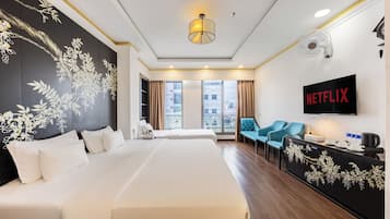 Family Room | Minibar, in-room safe, blackout curtains, iron/ironing board